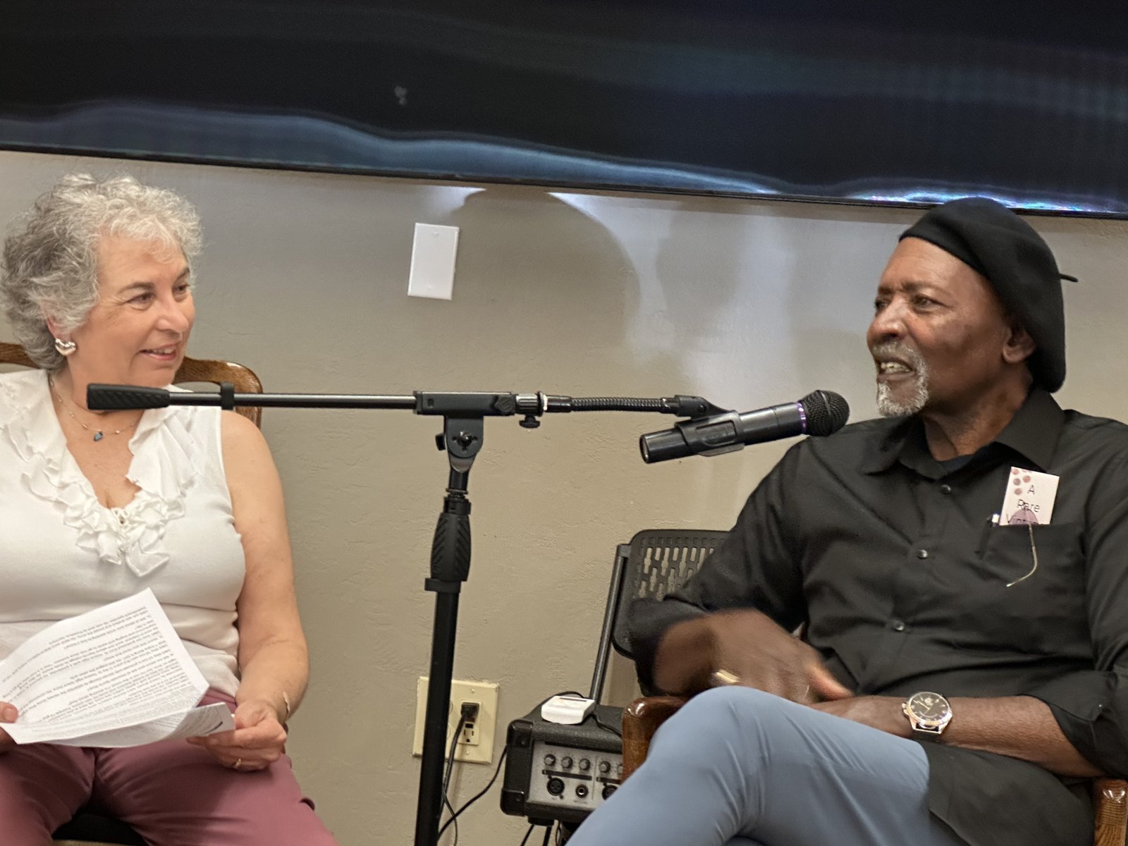 A moderator and a panelist speak at the “Growing Up Black in St. Helena” panel discussion.
