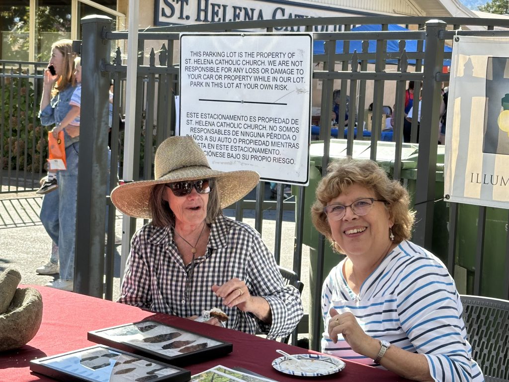 Two volunteers staffing the St. Helena Historical Society Harvest Festival booth